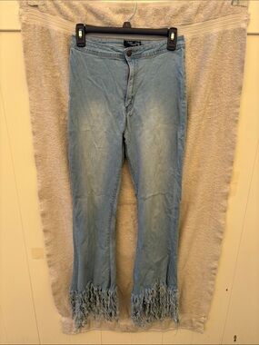 Blue shredded bell bottoms/flare legs